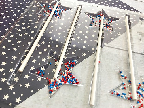 Chocolate Star Pops- If you want a fun and easy dessert to serve for a patriotic holiday, then you need to make these chocolate star pops! They're quick to make, and so delicious! | Memorial Day dessert, Fourth of July dessert, patriotic dessert recipe, chocolate dessert, #recipe #dessert #MemorialDay #FourthOfJuly #ACultivatedNest