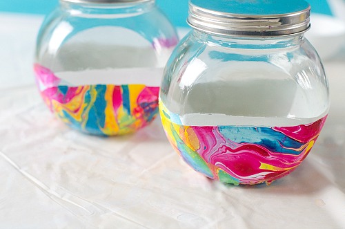 Marble Storage Jars Dollar Store DIY- Store bulk goods, candies, and more in style with these DIY marble storage jars! This easy project can be done with just dollar store supplies! | dollar store DIY, dollar store craft, dollar store organizing, painted jar, how to paint a glass jar, organization, organize