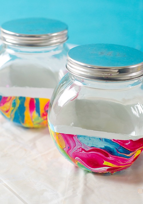 Marble Storage Jars Dollar Store DIY- Store bulk goods, candies, and more in style with these DIY marble storage jars! This easy project can be done with just dollar store supplies! | dollar store DIY, dollar store craft, dollar store organizing, painted jar, how to paint a glass jar, organization, organize