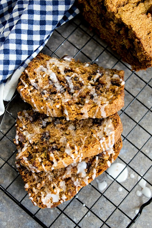 Chocolate Chip Zucchini Bread- If you need to use up some extra zucchinis, or want a clever (and tasty!) way to get your kids to eat some veggies, make this chocolate chip zucchini bread! | baking, dessert bread, vegetables, homemade, recipe, food, bread with glaze, bread with icing on top