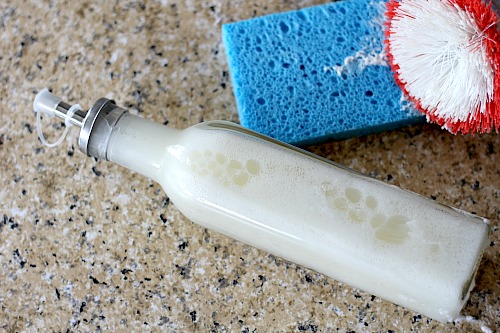 DIY Liquid Dish Soap- You don't need to use harmful chemicals to clean your family's dishes. Instead, make my easy, all-natural DIY liquid dish soap! | homemade soap, frugal living, how to make your own dish washing soap, essential oils