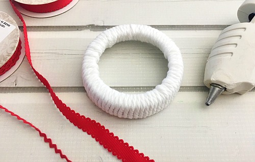 Candy Cane Mason Jar Lid Ornament- Make your Christmas tree even prettier this year with a DIY ornament! Check out my tutorial on how to make a cute candy cane Mason jar lid ornament! #Christmas #diy #craft #ornament