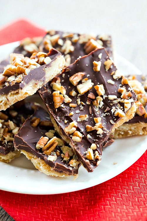 Saltine Toffee Candy with Pecans- For a sweet treat this Christmas, make some of these 15 classic candy recipes! There are so many delicious candies to choose from! | #ChristmasRecipes #candyRecipes #dessert #dessertRecipes #ACultivatedNest