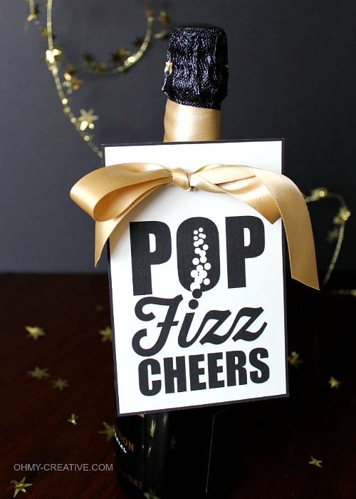 DIY New Year's Eve Champagne Tags- You can have a fun and glamorous New Year's Eve without spending a lot! Check out these 15 DIY New Year’s Eve décor ideas for inspiration! #DIY #NewYearsEve #decor #craft #ACultivatedNest