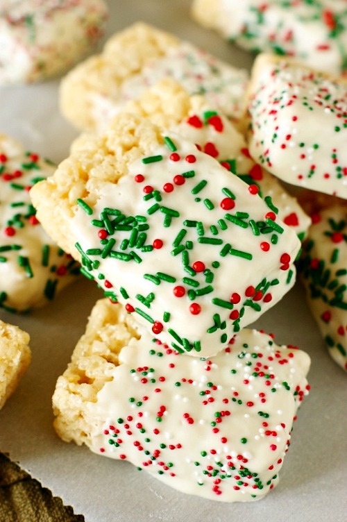 15 Christmas Rice Krispie Bar Recipes- A fun and delicious way to celebrate the holidays is with these homemade Christmas Rice Krispie Treats! | reindeer, wreath, Santa, elf, lumps of coal, #ChristmasRecipes #dessertRecipes #riceKrispies #desserts #ACultivatedNest