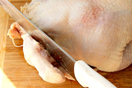 How to Quarter a Whole Chicken- You can save a lot of money on meat if you know how to quarter a whole chicken at home. And it only takes 5 minutes! Check out my easy tutorial! #frugalLiving #chicken #meat #saveMoney