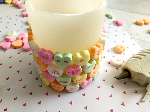 DIY Conversation Heart Valentine's Day Candle- Want a cute, yet inexpensive piece of Valentine's decor? Then you have to make this DIY conversation heart Valentine's Day candle! It's very easy to put together, and can be customized in many fun ways! | Valentine's craft, love, conversation heart candy, sweethearts, craft using food, hearts, #ValentinesDay #candle #diy #Valentines