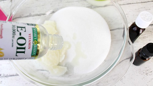 DIY Lemon and Rosemary Sugar Scrub- Tired of your skin looking dull? Make it moisturized and beautiful by using this DIY lemon and rosemary sugar scrub! It's easy to make, smells great, and even makes a great homemade gift! | #DIY #homemade #bodyScrub #beauty #diyGift #sugarScrub #faceScrub #handScrub