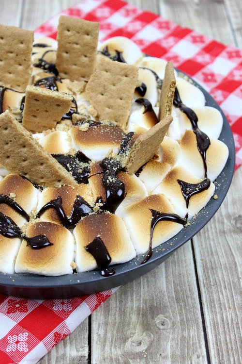 S'mores Brownie Bake- Want an ooey, gooey, and delicious dessert? Then you need to make this s'mores brownie bake! It's full of s'mores flavor, but is quick and easy to make at home in the oven! | #brownies #recipe #dessert #baking #chocolate #smores #camping #food #homemade #semiHomemade