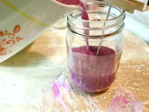 DIY Mason Jar Citronella Lavender Candle- Pouring candle wax. | homemade citronella candles, #DIY #candle #citronella #MasonJar #craft #allNatural #bugRepellent #mosquitoes #essentialOils