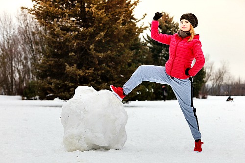 Get Out of Debt By Using The Debt Snowball Method - Woman conquering snowball. | budgeting, how to get out of debt, paying off bills #debt #debtFree #payOffDebt #getOutOfDebt #debtPayoff #payDownDebt #bills #debtSnowball #daveRamsey