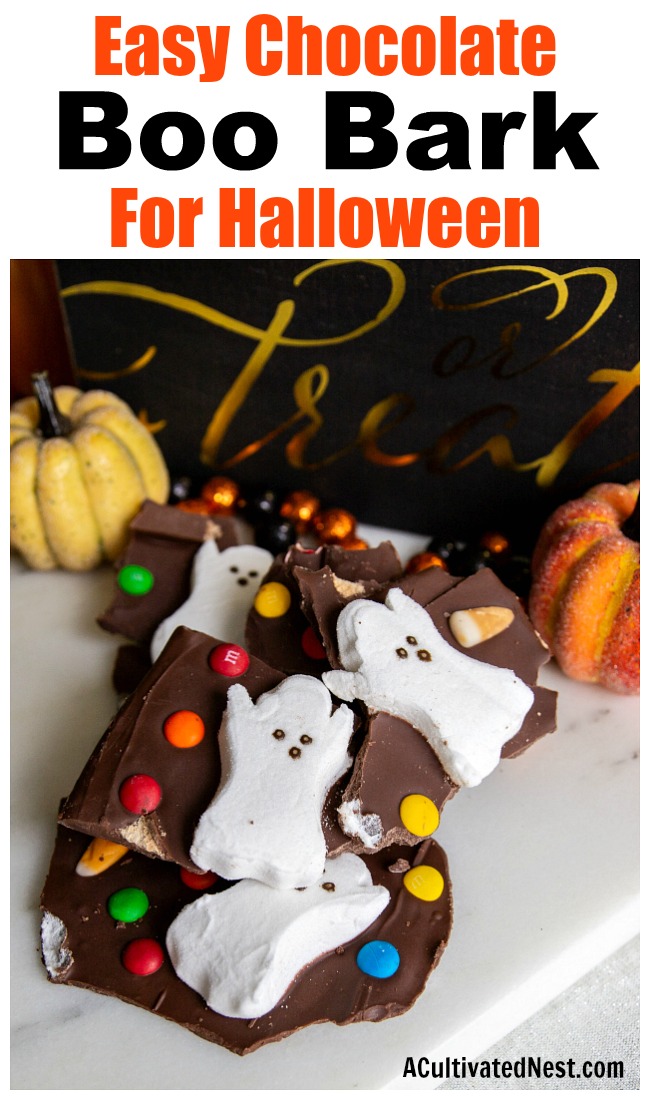 Halloween Milk Chocolate Boo Bark- For a fun and easy Halloween treat, make this Halloween Milk Chocolate Boo Bark! This is also a great way to use up leftover Halloween candy! | chocolate bark with candy, recipes that use up extra Halloween candy, #Halloween #chocolate #recipe #candy #dessert #chocolateBark #ACultivatedNest