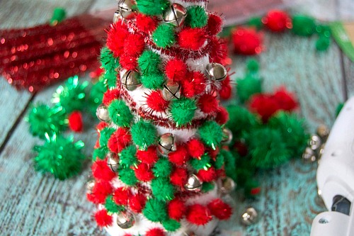 Dollar Store Christmas Decor DIY- Add pretty (and inexpensive) decor to your Christmas table or mantel with this DIY dollar store Christmas tree centerpiece! | Christmas craft, holiday DIY, pom pom Christmas tree, dollar store craft, #Christmas #DIY #ACultivatedNest