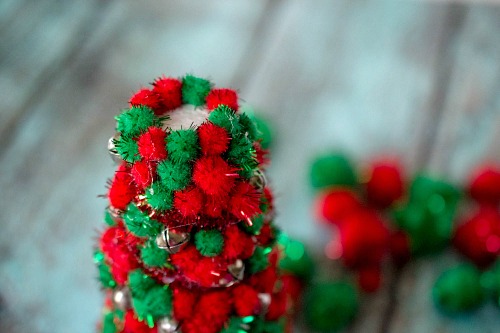 Pom Pom Christmas Tree Centerpiece- Add pretty (and inexpensive) decor to your Christmas table or mantel with this DIY dollar store Christmas tree centerpiece! | Christmas craft, holiday DIY, pom pom Christmas tree, dollar store craft, #Christmas #DIY #ACultivatedNest