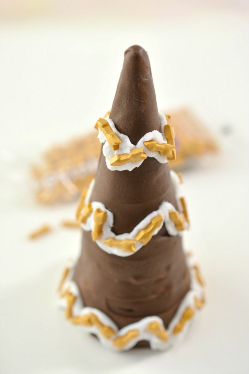 Chocolate Party Hat Treats Appetizer- These festive and easy New Year's party hat treats are quick chocolatey treats that are sure to make your New Year's Eve party delicious! | easy dessert, chocolate New year's Eve recipe, party food, celebration food, #appetizer #NewYearsEve #ACultivatedNest