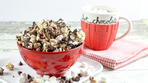 Hot Chocolate Popcorn- This hot chocolate popcorn snack is perfect for winter! It's so delicious, and a very easy dessert popcorn to make for every day, or for family movie night! | easy chocolate snack recipe idea, #chocolate #popcorn #ACultivatedNest