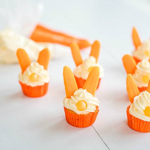 Easter Bunny Carrot Cupcakes Snacktivity- Keep your kids entertained this Easter with these 17 fun and frugal Easter kids activities! They're so fun, and very inexpensive! | spring kids crafts, paper plate crafts, bunny kids crafts, DIY easter eggs, #Easter #kidsActivities #ACultivatedNest