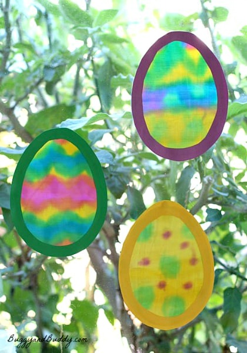 Egg Suncatchers- Keep your kids entertained this Easter with these 17 fun and frugal Easter kids activities! They're so fun, and very inexpensive! | spring kids crafts, paper plate crafts, bunny kids crafts, DIY easter eggs, #Easter #kidsActivities #ACultivatedNest