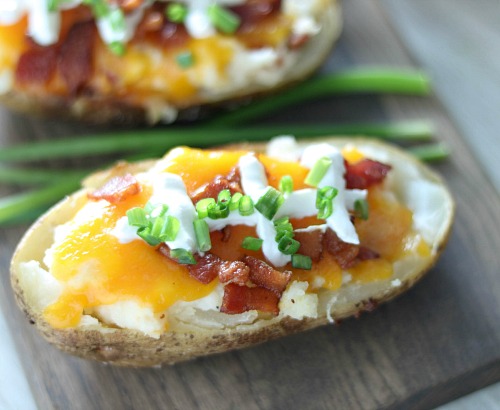 Loaded Baked Potatoes That Look Like Footballs- These loaded twice baked potatoes look just like little footballs! These make a great game day appetizer recipe for any football watch party! | #appetizer #recipe #ACultivatedNest