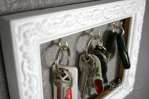DIY Key Organizer- An inexpensive and easy way to make pretty decor is with dollar store materials! Check out all of this pretty home decor made with dollar store frames! | dollar store decor DIY projects, dollar store crafts, upcycle old frames, #dollarStore #dollarTree #DIY #decor #AcultivatedNest