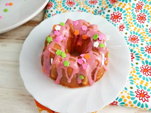 Spring or Easter Mini Bundt Cakes- The perfect way to celebrate spring is with these easy (and delicious) spring mini bundt cakes! They're so fun to decorate, and look so cheerful! | spring dessert recipe, Easter dessert recipe, #dessert #recipe #spring #baking #ACultivatedNest