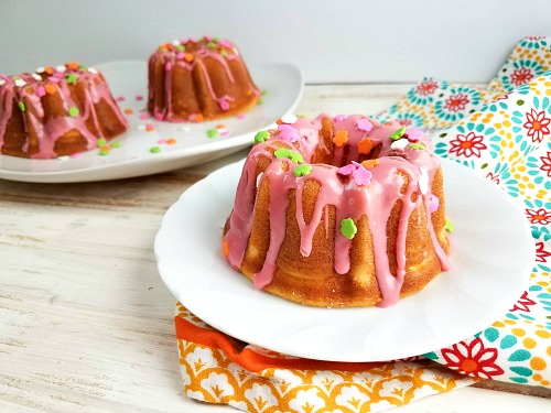 Spring Mini Bundt Cakes- The perfect way to celebrate spring is with these easy (and delicious) spring mini bundt cakes! They're so fun to decorate, and look so cheerful! | spring dessert recipe, Easter dessert recipe, #dessert #recipe #spring #baking #ACultivatedNest