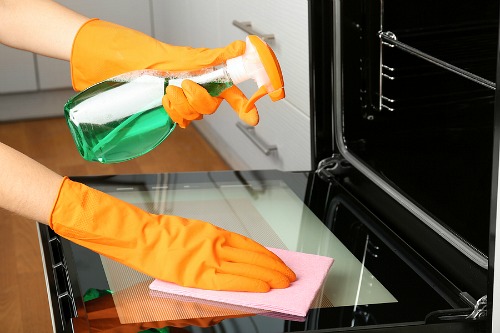 Cleaning Your Oven with a Store Bought Cleaner- Tired of your oven being a mess? This huge oven cleaning guide has all the easiest ways to clean your oven, inside and out! | kitchen cleaning tips, clean oven glass, clean oven racks, #kitchenCleaning #ovenCleaning #cleaningTips #ACultivatedNest