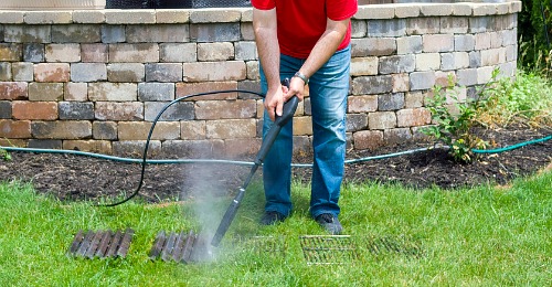 Pressure Wash Your Grill Racks- It doesn't have to take ages to clean your gas or charcoal grill, if you know these tips! Here are all the best tips and tricks for how to clean your grill the easy way! | clean grill grates, grill cleaning hacks, clean charcoal grill, clean gas grill, clean grill at the end of summer, #grilling #cleaningTips #cleaning #ACultivatedNest