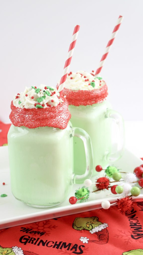 Boozy Grinch Milkshakes Recipe- This is the ultimate list of easy and delicious Christmas drink recipes. Serve them at your next holiday party and everyone will rave about them for sure! | holiday drink recipes, nonalcoholic drinks, kid friendly drinks, hot drinks, cold drinks, #recipe #drinks #ChristmasDrinks #alcoholicDrinks #ACultivatedNest