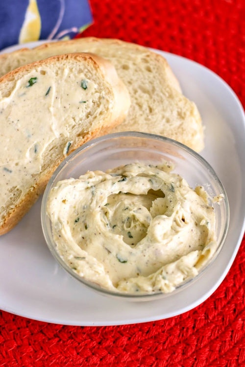 Homemade Garlic Butter Recipe- As soon as you try this incredibly easy garlic butter recipe, you're sure to be hooked. It goes great with seafood, steak, vegetables, bread, and more! | roasted garlic butter, homemade spread, #recipe #homemade #butter #garlic #ACultivatedNest