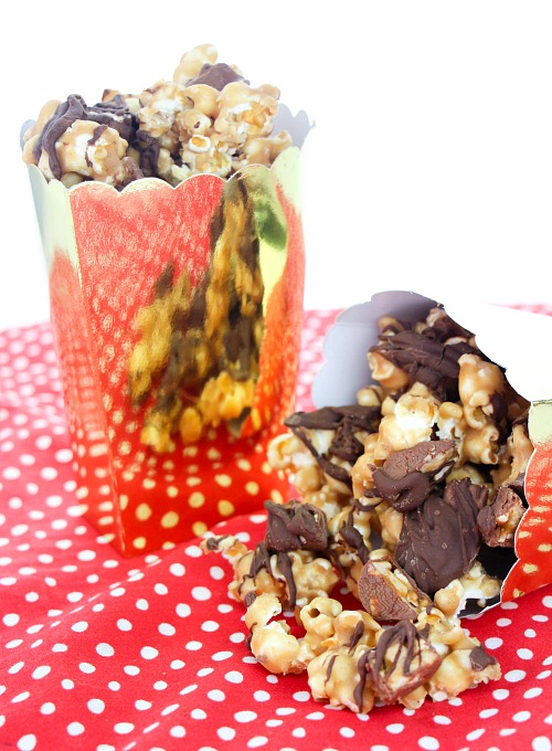 Homemade Snickers Popcorn DIY Food Gift- If you are looking for a movie night treat, this delicious homemade Snickers popcorn is what you need! It's easy to make and will win over a crowd! | way to use up leftover Halloween Candy, DIY food gifts, #popcorn #recipe #dessertPopcorn #leftoverHalloweenCandy #ACultivatedNest