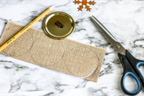 Burlap Mason Jar Lid Ornament DIY- This beautiful burlap Mason jar lid ornament is easy to make and would look lovely on your Christmas tree! It also makes a great DIY ornament gift! | homemade ornament, rustic Christmas ornament DIY, #ChristmasCraft #ChristmasOrnament #craft #DIY #ACultivatedNest