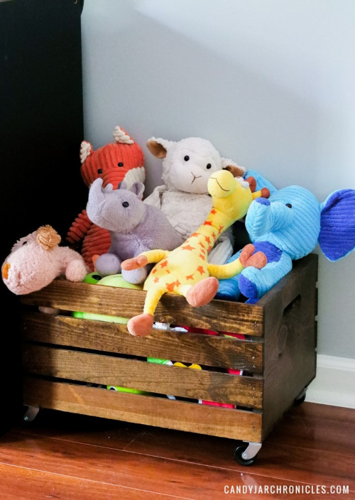 Wooden Crate Toybox- Tired of toys lying everywhere? You and your kids need these creative DIY toy storage ideas! They're easy to implement and look nice too! | kids room organization, kids playroom organization, how to organize kids toys, #toyStorage #toyOrganization #organizingTips #organization #ACultivatedNest