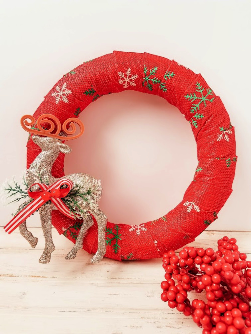 DIY Reindeer Holiday Wreath- Want to decorate for the holidays on a budget? This pretty reindeer wreath dollar store DIY can be made with just a few steps and inexpensive dollar store supplies! | #diyProject #wreath #ChristmasDecor #ChristmasWreath #ACultivatedNest