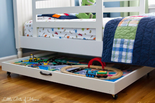 Train Table Storage Idea- Tired of toys lying everywhere? You and your kids need these creative DIY toy storage ideas! They're easy to implement and look nice too! | kids room organization, kids playroom organization, how to organize kids toys, #toyStorage #toyOrganization #organizingTips #organization #ACultivatedNest