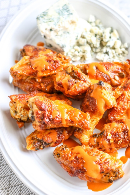 Game Day Buffalo Chicken Wings- Every taste of these easy, drool-worthy air fryer buffalo chicken wings is better than the last. You'll be licking your fingers because they are so good! | #recipe #food #airFryer #chickenWings #ACultivatedNest