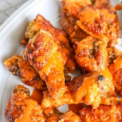 Air Fryer Buffalo Chicken Wings- Every taste of these easy, drool-worthy air fryer buffalo chicken wings is better than the last. You'll be licking your fingers because they are so good! | #recipe #food #airFryer #chickenWings #ACultivatedNest