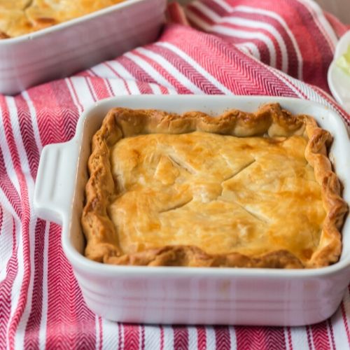 Comforting Homemade Chicken Pot Pie- Enjoy a helping of this delicious homemade chicken pot pie after a long day. It's super flavorful and packed with chicken and veggies inside of a flaky golden crust! | what to make with leftover chicken, #recipe #homemade #chicken #dinnerRecipe #ACultivatedNest