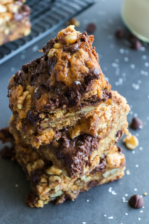 Caramel Chocolate Chewy Cookie Bars Recipe- One taste of these delectable salted caramel cookie bars and you will be addicted! They are soft, chewy, and full of chocolate, caramel, and nuts. | #recipe #dessert #caramel #chocolate #ACultivatedNest