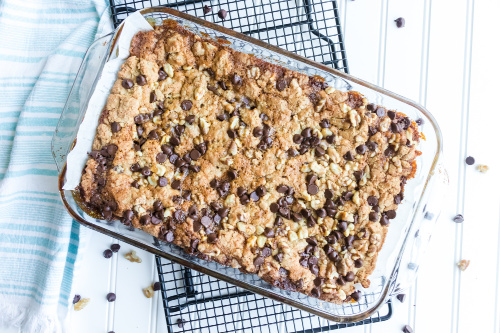 Caramel Chocolate Cookie Bars- One taste of these delectable salted caramel cookie bars and you will be addicted! They are soft, chewy, and full of chocolate, caramel, and nuts. | #recipe #dessert #caramel #chocolate #ACultivatedNest