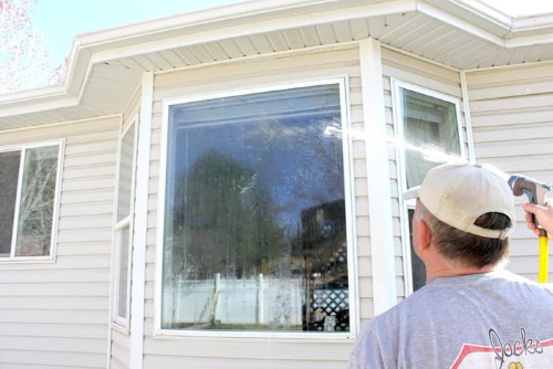 Clean Your Windows- Your yard is going to look fabulous with these brilliant backyard cleaning tips! It will be ready for entertaining, sipping on sweet tea, or resting. | how to clean your patio, how to clean your fence, how to clean your backyard, #cleaningTips #cleaning #backyard #yard #ACultivatedNest