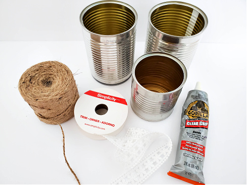 Twine and Lace Upcycled Cans Craft- Don't throw out your tin cans! Instead, use them to make this cute twine and lace upcycled cans craft! This makes a great décor piece, or desk organizer! | #upcycle #craft #upcycling #diyProject #ACultivatedNest