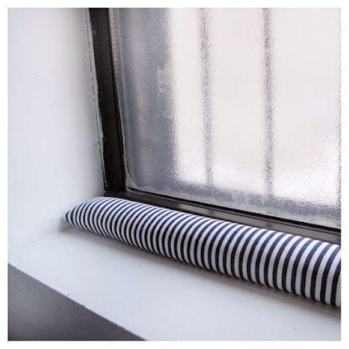 12 DIY Draft Stopper Projects for Cold Windows and Doors- Say goodbye to cold drafts with these clever and stylish DIY draft stopper projects! Learn how to make your own draft snakes and stoppers to keep your home warm all winter long. Perfect for crafters and anyone looking to save energy. | #DraftStopper #DIYIdeas #frugalLiving #WinterDIY #ACultivatedNest
